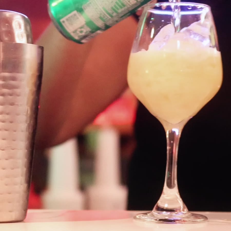 A fresh drink being poured at the bar