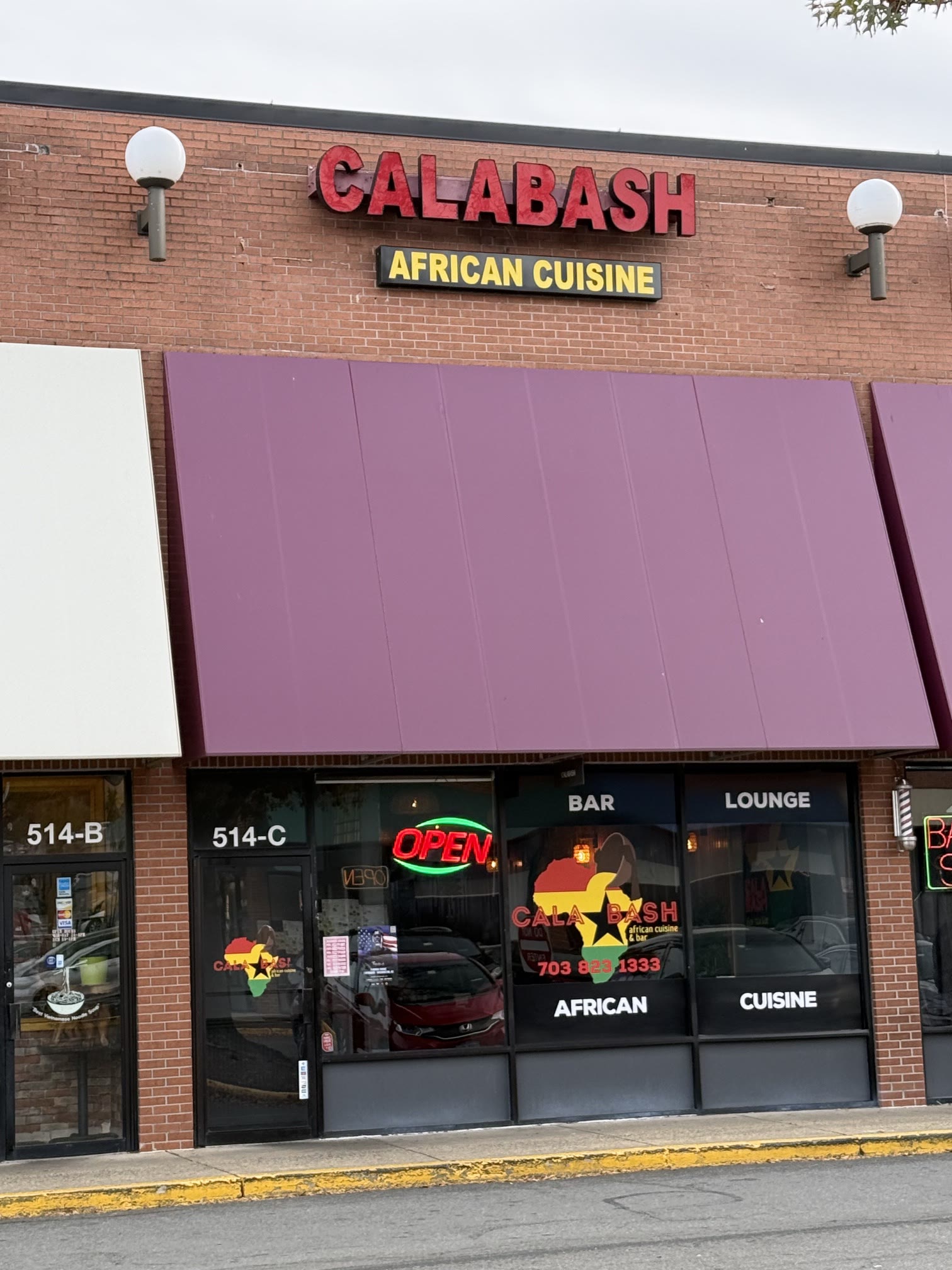 The Calabash storefront with its purple awning, unit 514-C